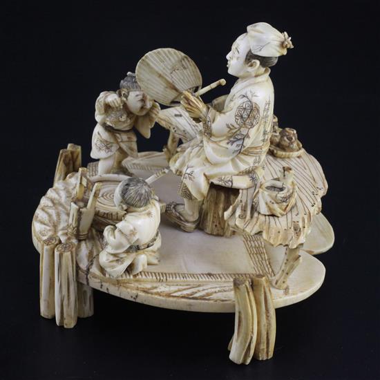 A Japanese ivory okimono of a man and two boys, signed Shomi, Meiji period 13cm, some faults